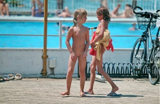 Young and adult nudists in an aquapark [Pure naturism]