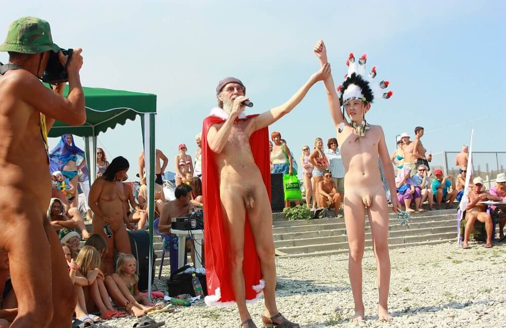 Native Headdress Dance pics - Harmony and balance are important in this nudist culture