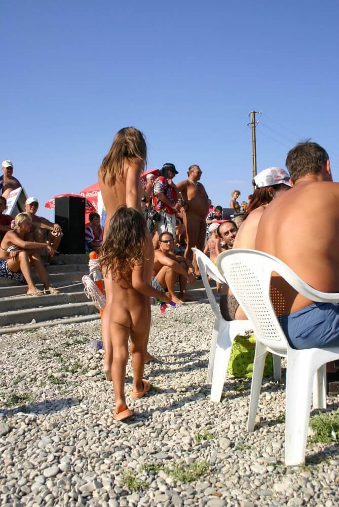 Naturist Standing Sideline - Living freely and naturally is the dream of naturism and nudism advocates