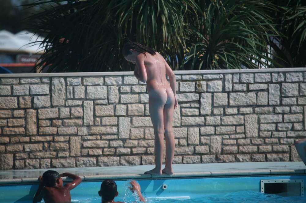 Naturist Pool-Side Singles pics - Nudists relax beautifully—a sight to behold