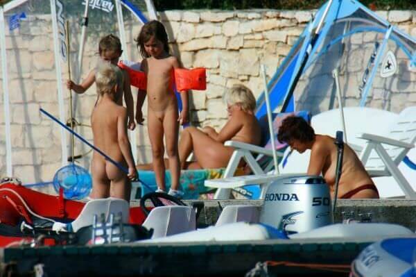 By the boat photos - Interaction with nature through naturism and nudism
