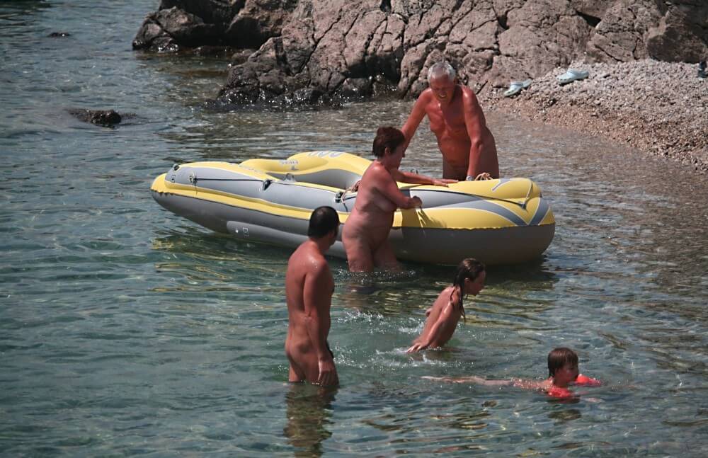 Lone Nudist in Yellow Boat photos - Love for oneself and nature is the foundation of the naturist and nudist lifestyle
